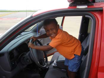 TJ on the runway driving the fire vehicle